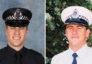 Police killed in Australia shooting named as manhunt continues