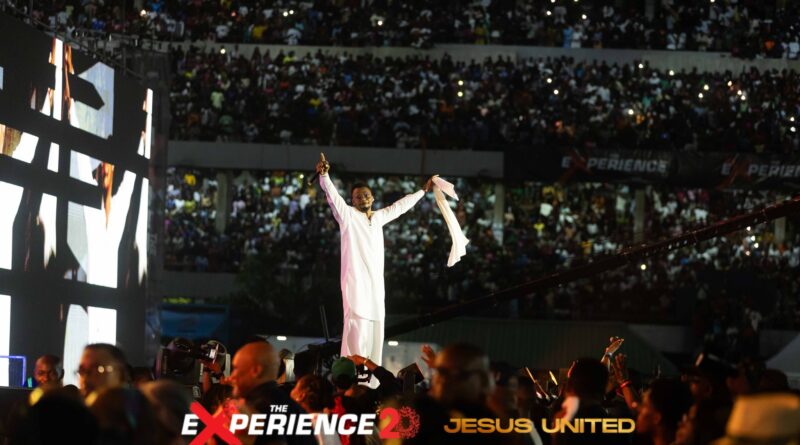 EmmaOMG The Experience Surprise 2025 on stage with Muyiwa Olanrewaju