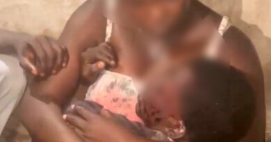 A Mother’s Grip: Holding Her Son Amidst the Jos Crisis